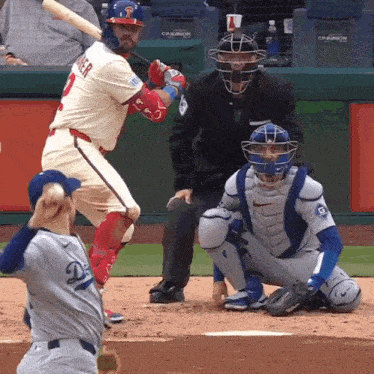 a baseball player with the number 3 on his jersey swings his bat