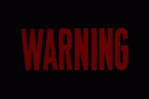 the word warning is glowing brightly in red on a black background