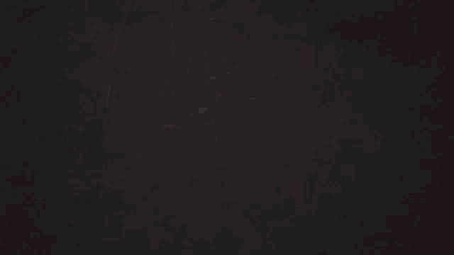 a person doing push ups in the dark with a pink light behind them