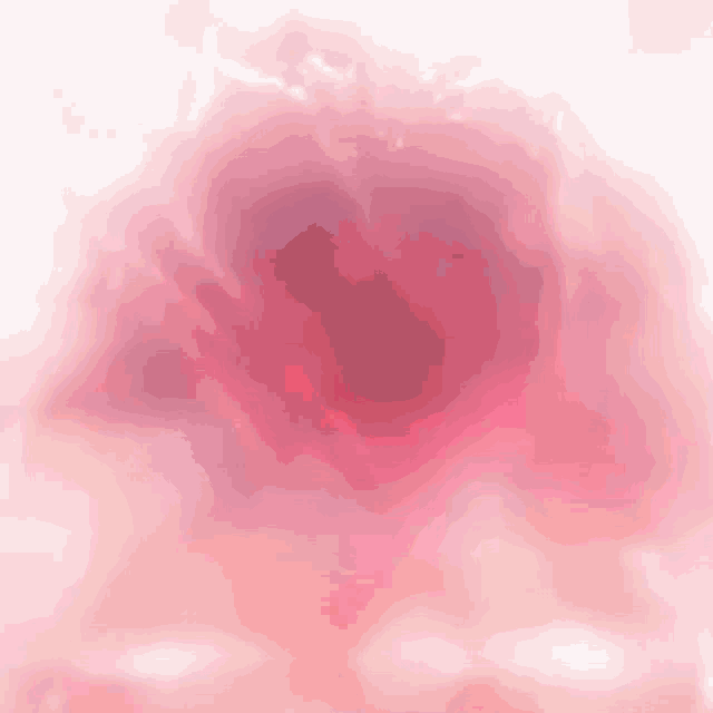 a close up of a pink background with a heart in the middle