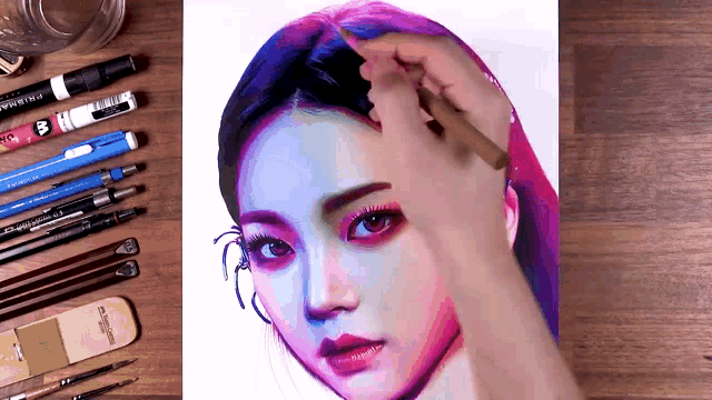 a person is drawing a woman 's face with a pencil that says prismacolor on it