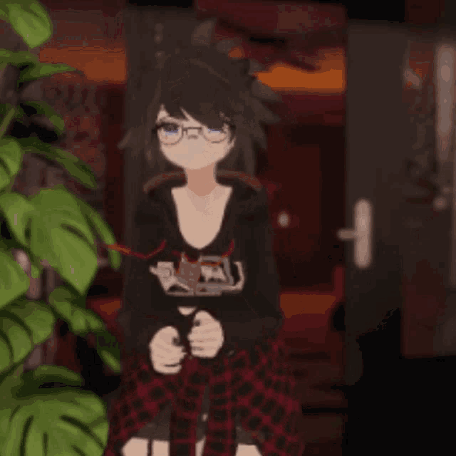 a girl with glasses and a shirt that says ' a ' on it is standing in front of a door