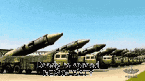 a row of military vehicles with the words ready to spread democracy at the bottom