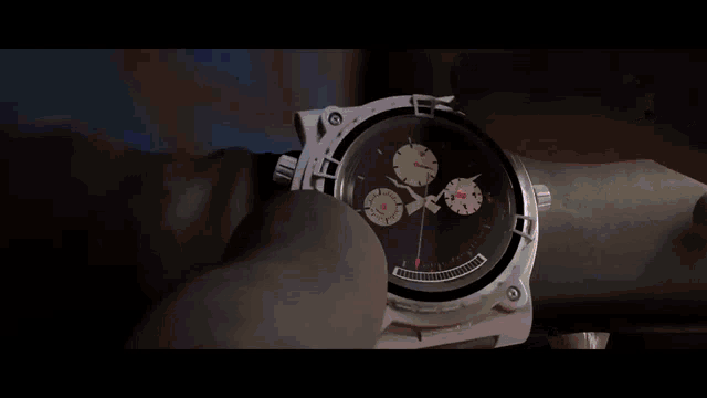a close up of a watch with the hands on the numbers 10 and 12