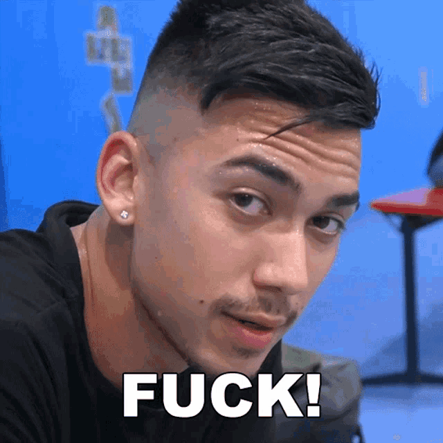 a man with sweat on his face has the word fuck written on his face