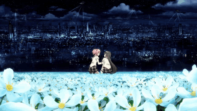 two girls are sitting in a field of white flowers
