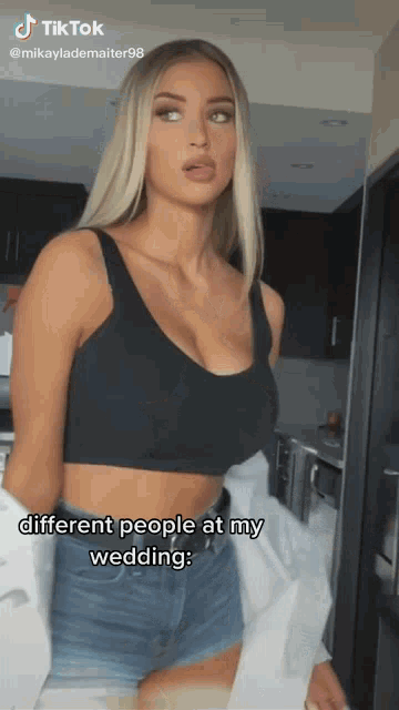 a woman in a black crop top and denim shorts says different people at her wedding