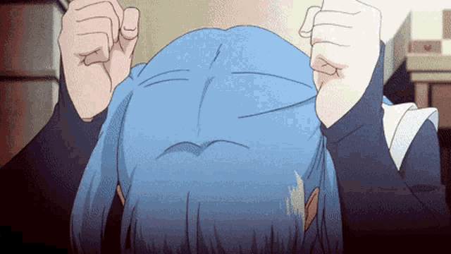 a girl with blue hair is holding her head with her hands