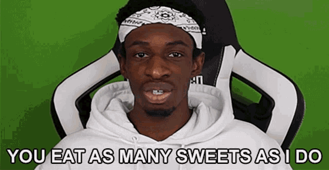 a man with a bandana on his head is sitting in a chair and says you eat as many sweets as i do