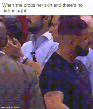 a man is talking to another man in a crowd while a woman drops her skirt .