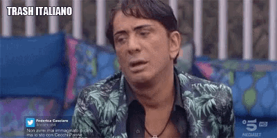 a man in a floral jacket is on a screen that says trash italiano on it