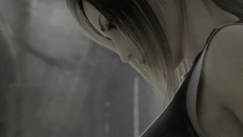 a close up of a woman 's face with her eyes closed
