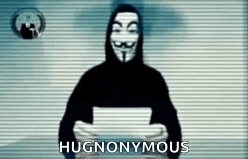 a man in a hooded sweatshirt is holding a piece of paper and the words hugnomous are on the screen behind him