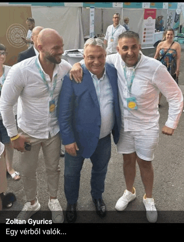 a group of men posing for a photo with the caption " zoltán gyurics "