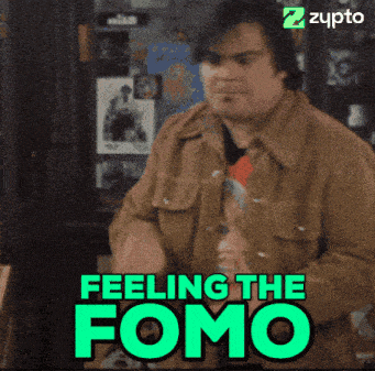 a man in a brown jacket is standing in front of a green sign that says feeling the fomo