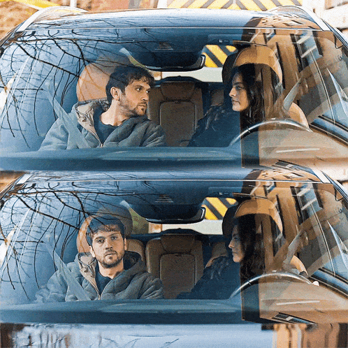 a man and a woman are sitting in a car and looking at each other
