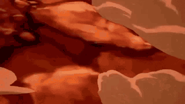 a close up of a person 's torso in a video game with a lot of clouds in the background .