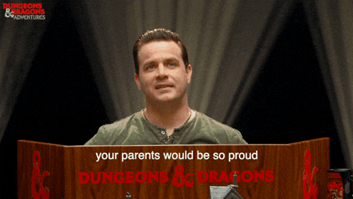 a man stands behind a podium that says your parents would be so proud