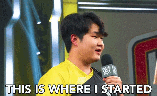 a man in a yellow shirt is holding a microphone and says " this is where i started "