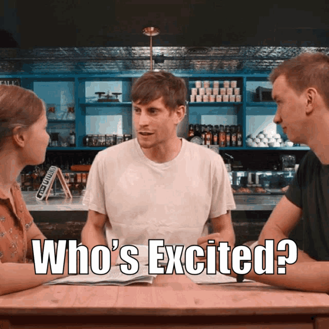a man and woman are sitting at a table with the words who 's excited on the bottom