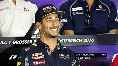 a man wearing a hat that says red bull on it
