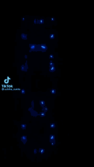 a blue neon sign that says demon slayer on it .