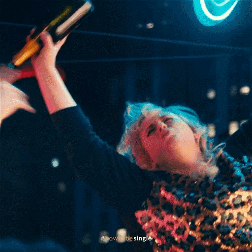 a woman is screaming with the word woo written above her