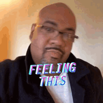 a man with glasses and a beard has the words feeling this on his face