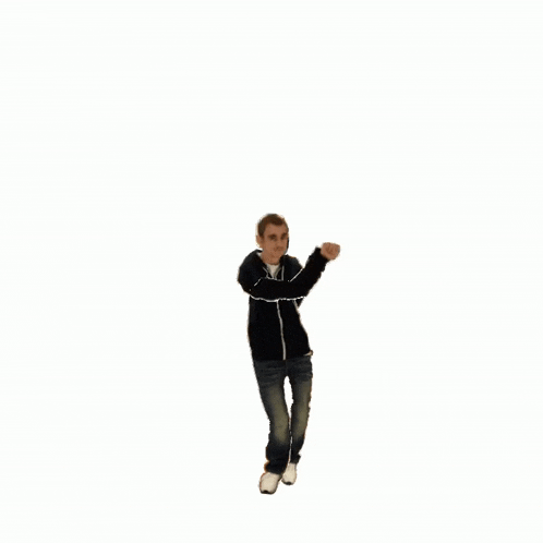 a man in a black jacket and jeans is jumping in the air