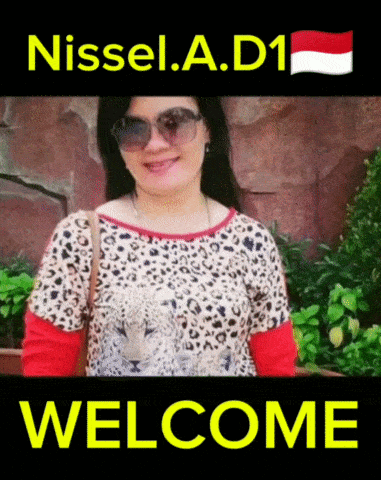 a woman in a leopard print shirt is standing in front of a welcome sign