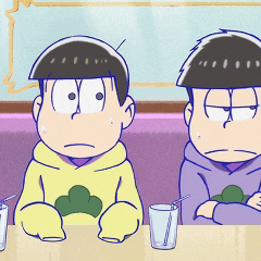 a couple of cartoon characters sitting at a table