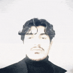 a man with a mustache is wearing a black turtleneck sweater