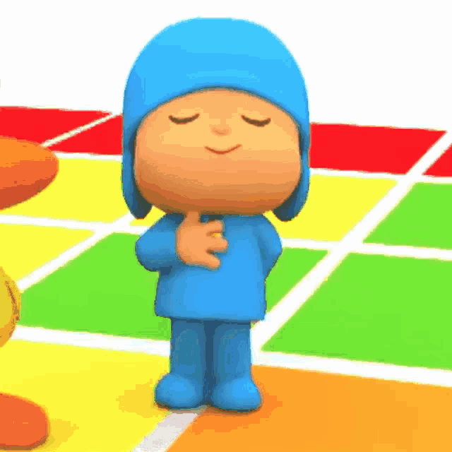 a cartoon character named pocoyo is standing on a colorful tiled floor with his eyes closed