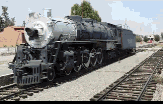 a train is on the tracks and has a sign that says ' a ' on the front