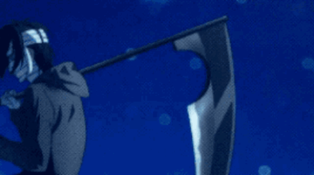 a man is holding a large scythe in front of a girl .