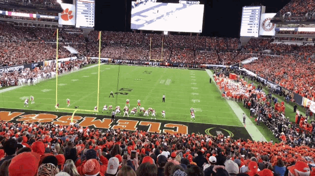 a football game is being played in a stadium that has the word clemson on the field