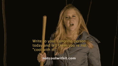 a woman holding a wooden stick with the words write to your congress person today and tell them you 're not cool with it ..