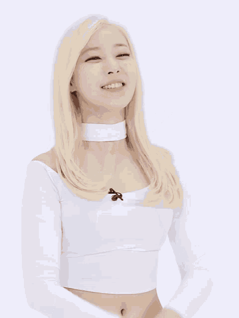 a woman with blonde hair is wearing a white top