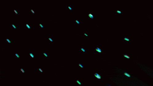 a blurred image of a person 's face with a green background