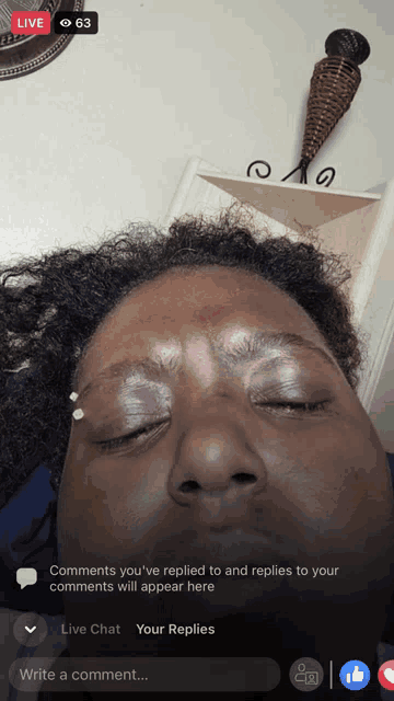 a woman 's face is shown in a live chat with the number 63 in the upper right corner