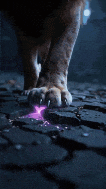 a close up of a lion 's paw with a purple light coming out of it .