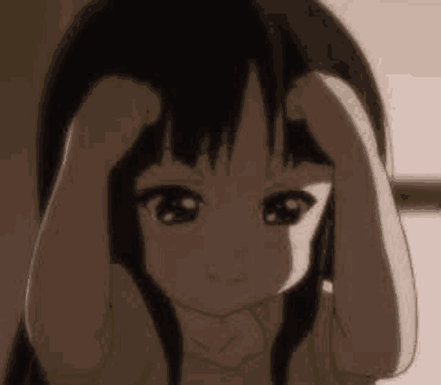 a little girl is holding her head with her hands while looking at the camera .