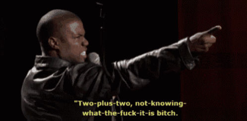 a man speaking into a microphone with the words " two-plus-two not-knowing what the fuck it is bitch "