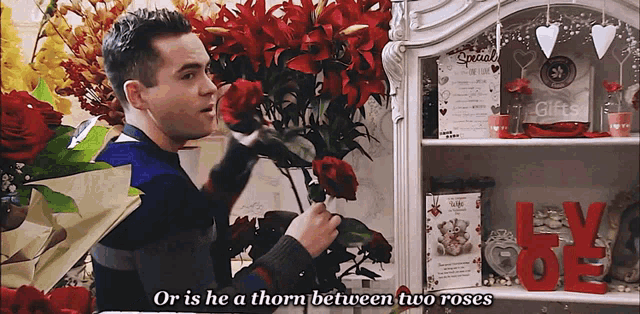 a man holds a red rose in front of a sign that says special gifts