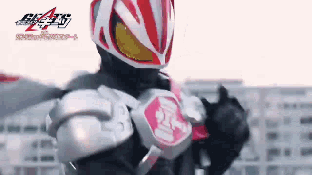 a close up of a person wearing a red and white helmet