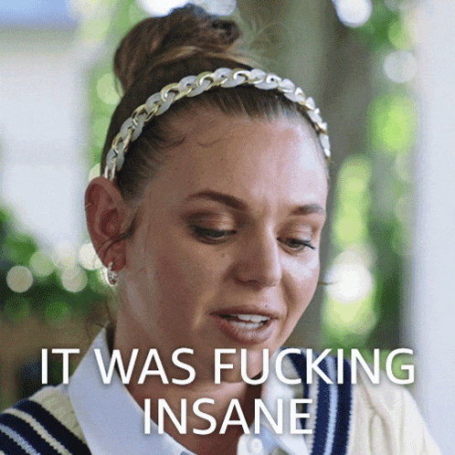 a woman wearing a headband with the words it was fucking insane on the bottom