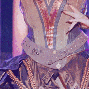 a close up of a belt on a person 's waist with a purple background