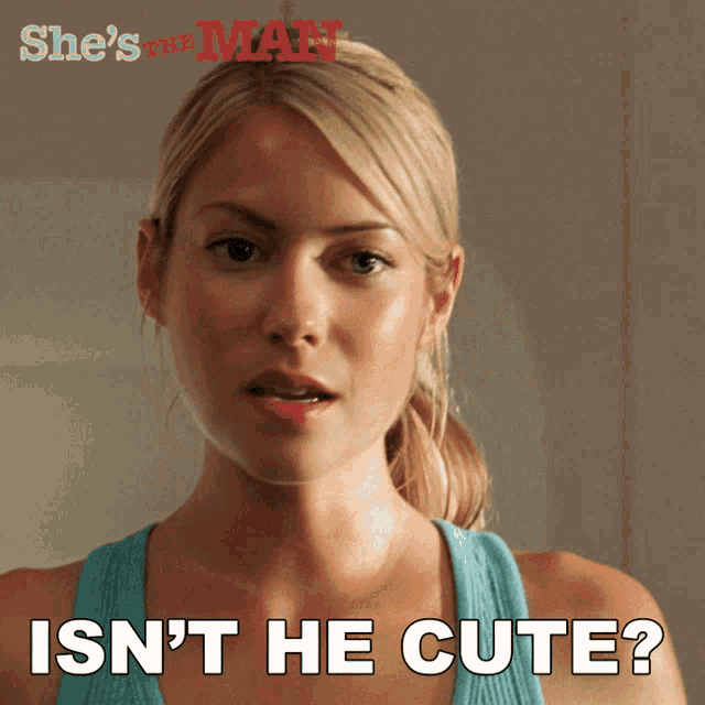 a woman in a blue tank top with the words isn 't he cute above her