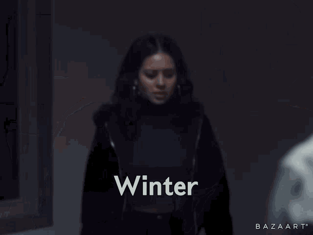 a woman is standing next to a man and the word vinter is on the bottom