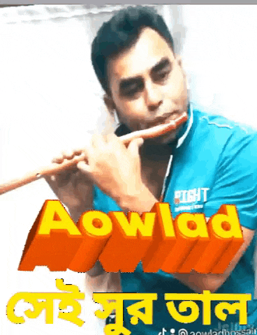 a man in a blue shirt is playing a flute in front of a sign that says aowlad